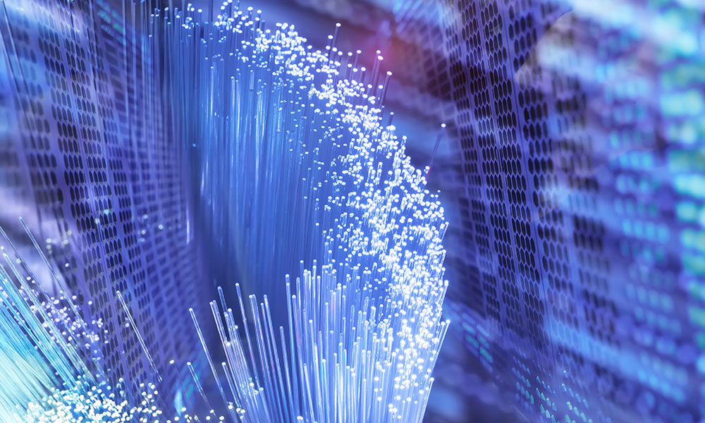 Fiber optics network cable on technology background